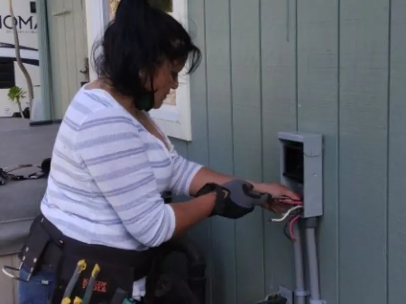 Licensed electrician wiring an exterior subpanel in Gloucester Point